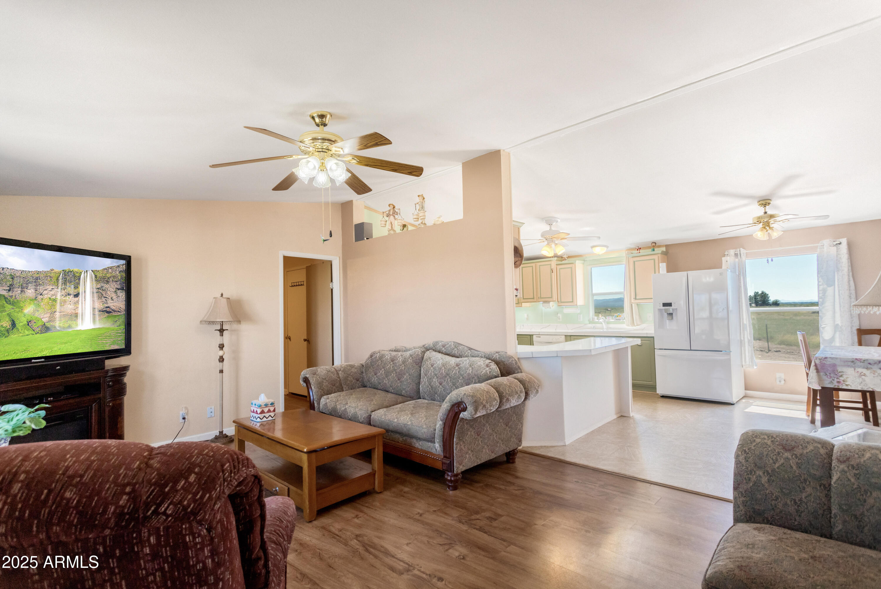 1907 East Vía Ocotillo Douglas, AZ 85607 - Photo 11 of 49 a living room with furniture and a flat screen tv
