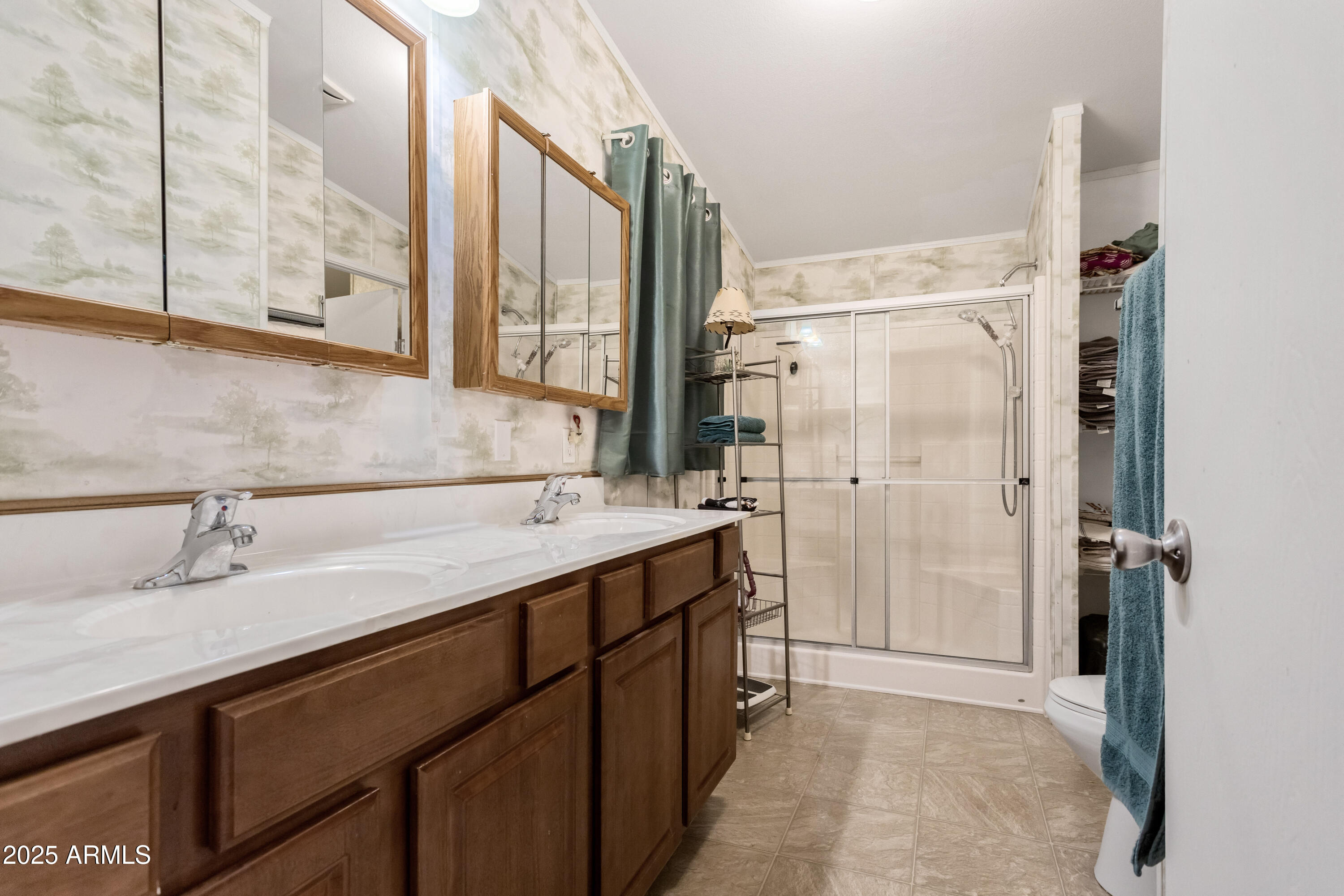 1907 East Vía Ocotillo Douglas, AZ 85607 - Photo 17 of 49 a bathroom with a shower sink and mirror