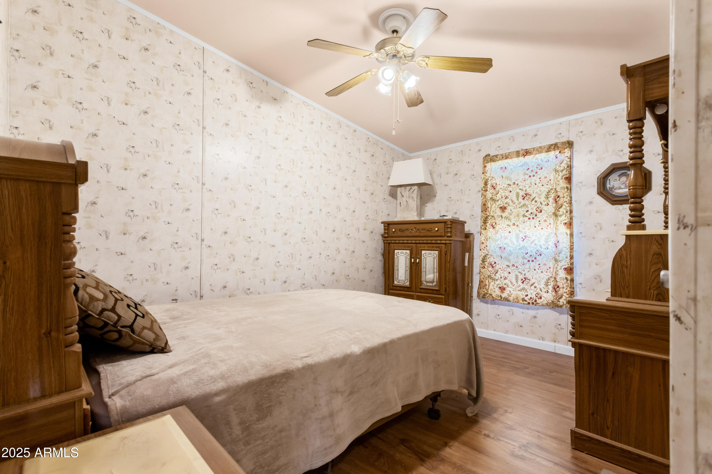 1907 East Vía Ocotillo Douglas, AZ 85607 - Photo 20 of 49 a bedroom with a bed dresser and a fireplace