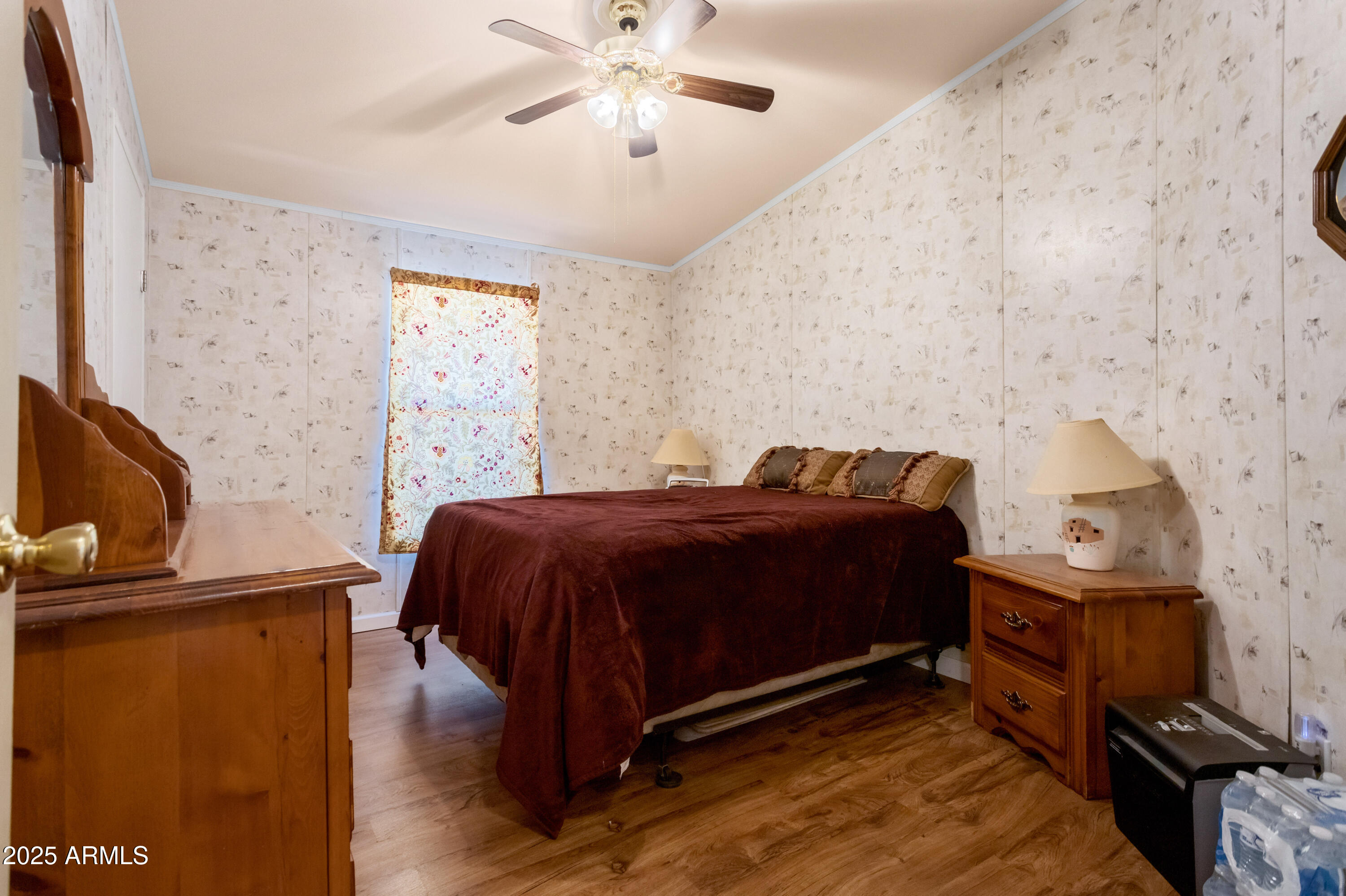 1907 East Vía Ocotillo Douglas, AZ 85607 - Photo 21 of 49 a spacious bedroom with a bed and a flat screen tv