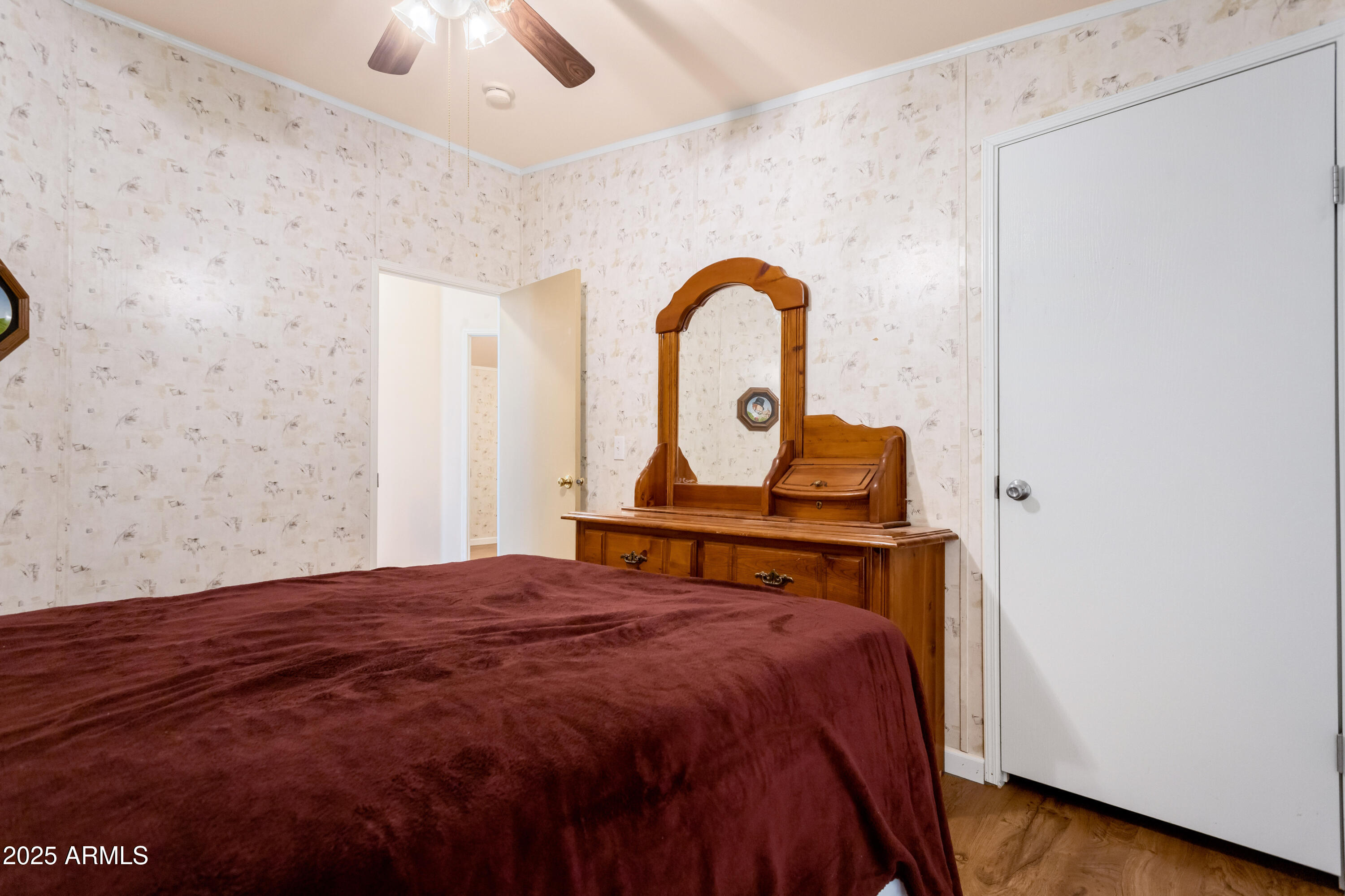 1907 East Vía Ocotillo Douglas, AZ 85607 - Photo 22 of 49 a bedroom with a bed and a chandelier