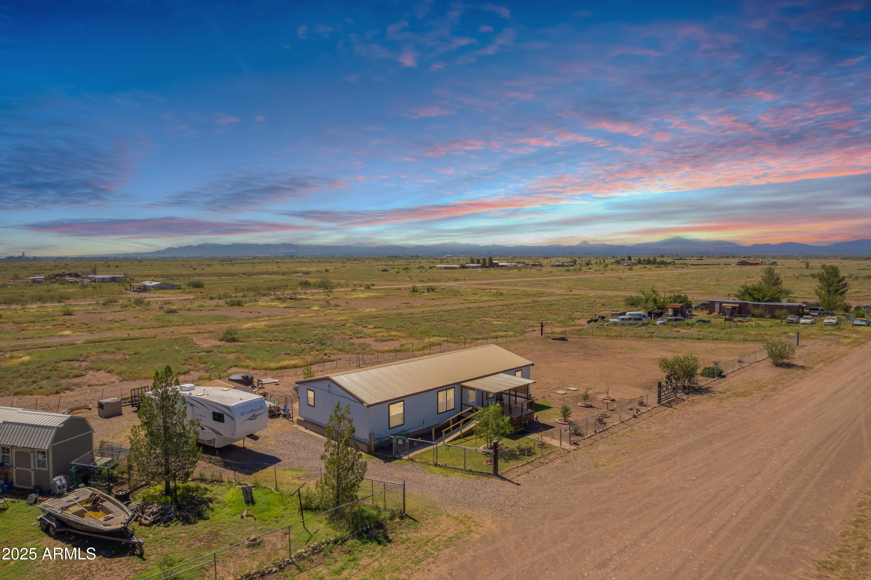 1907 East Vía Ocotillo Douglas, AZ 85607 - Photo 27 of 49 a view of a lake with table and chairs