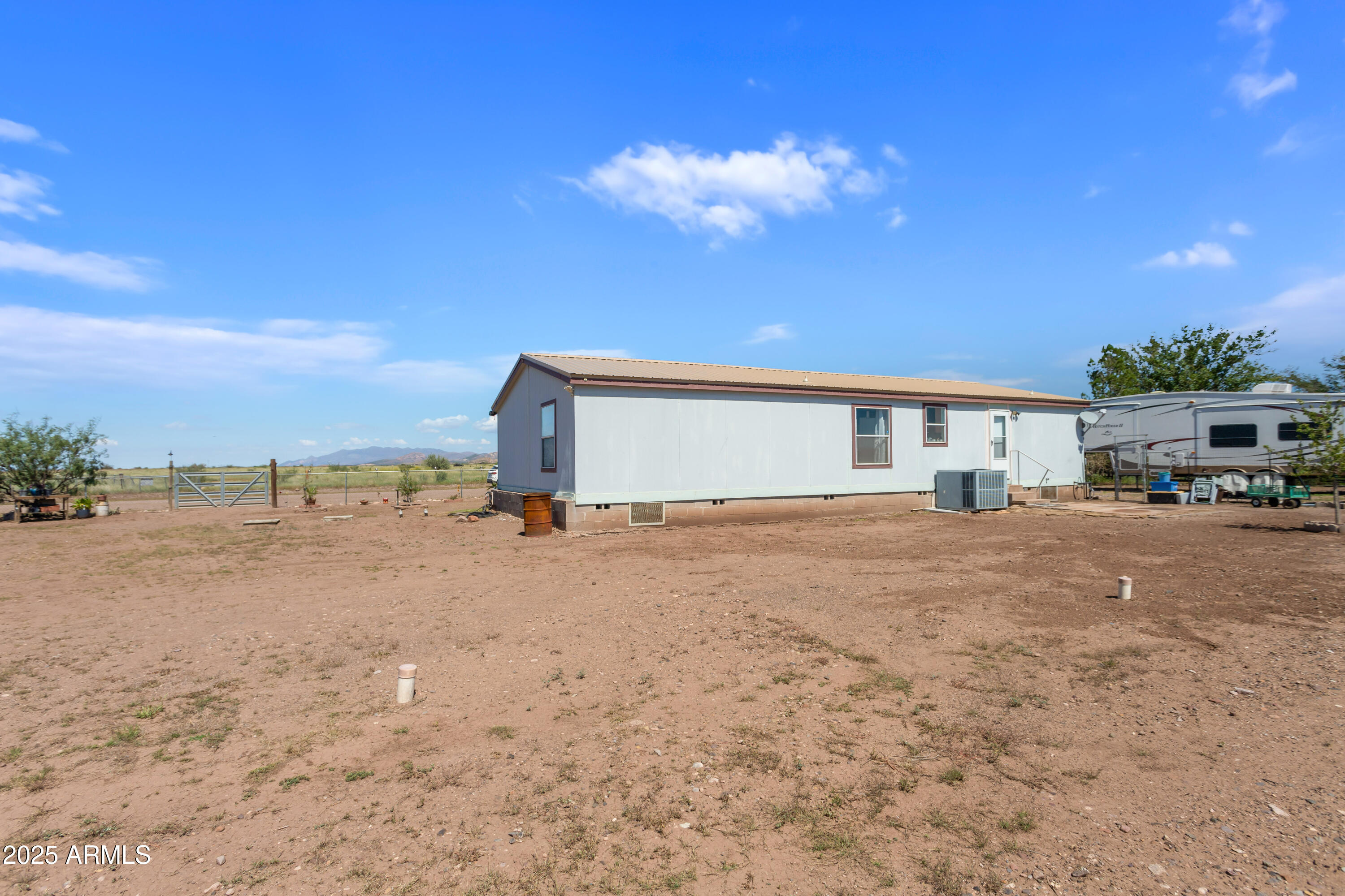 1907 East Vía Ocotillo Douglas, AZ 85607 - Photo 47 of 49 a view of a house with a big yard and large tree