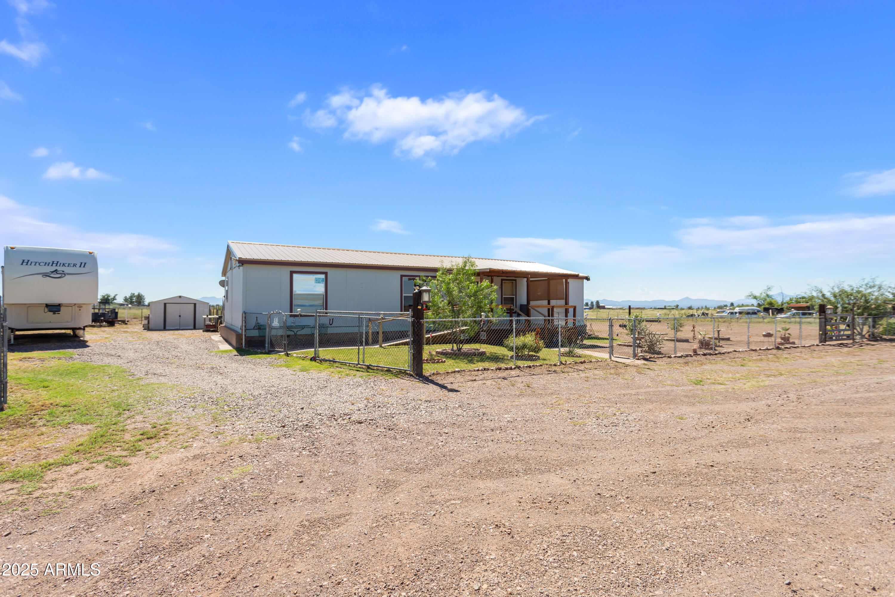 1907 East Vía Ocotillo Douglas, AZ 85607 - Photo 49 of 49 a view of a house with backyard porch and sitting area