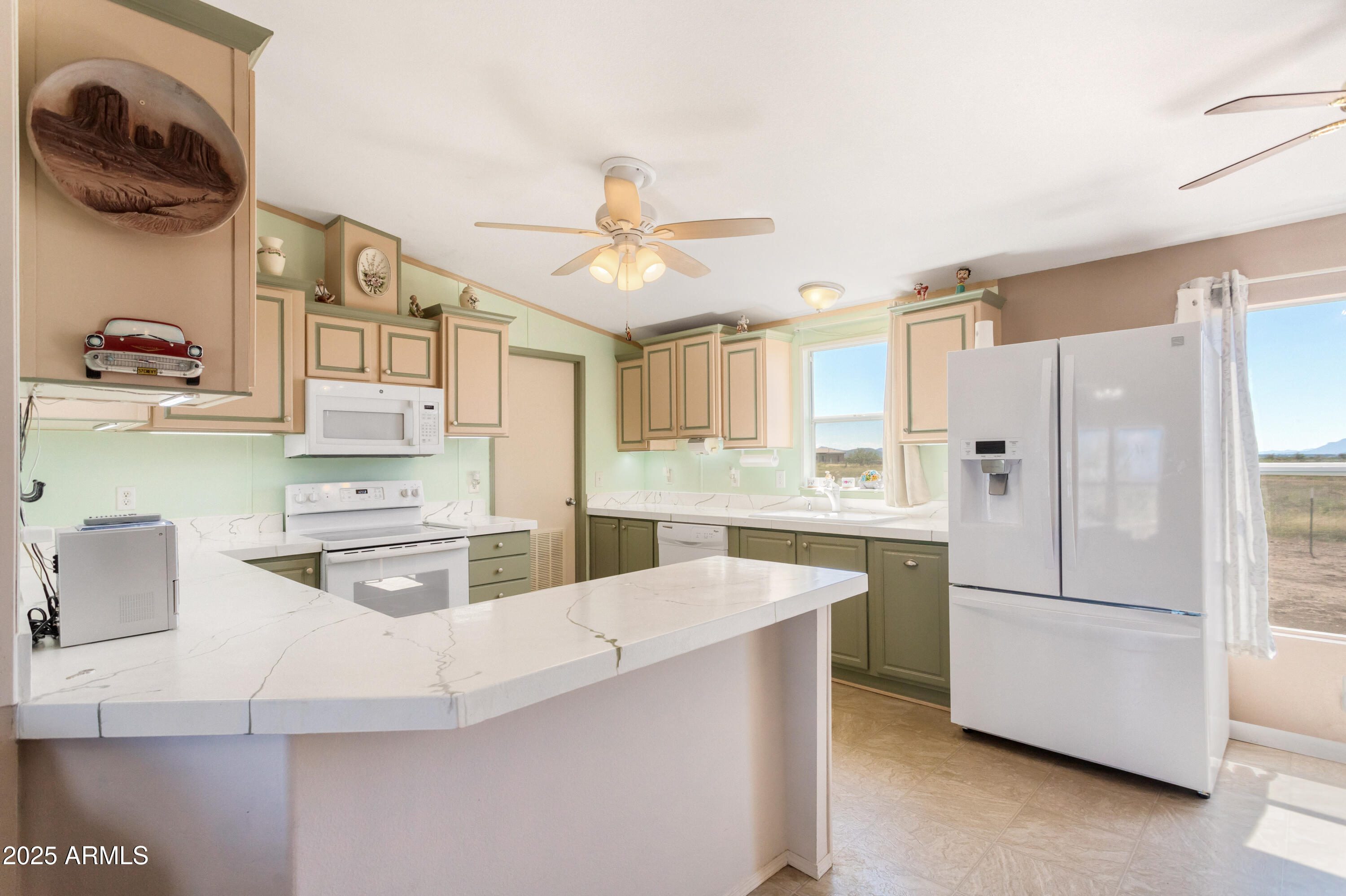 1907 East Vía Ocotillo Douglas, AZ 85607 - Photo 5 of 49 a kitchen with stainless steel appliances a stove a sink and a refrigerator