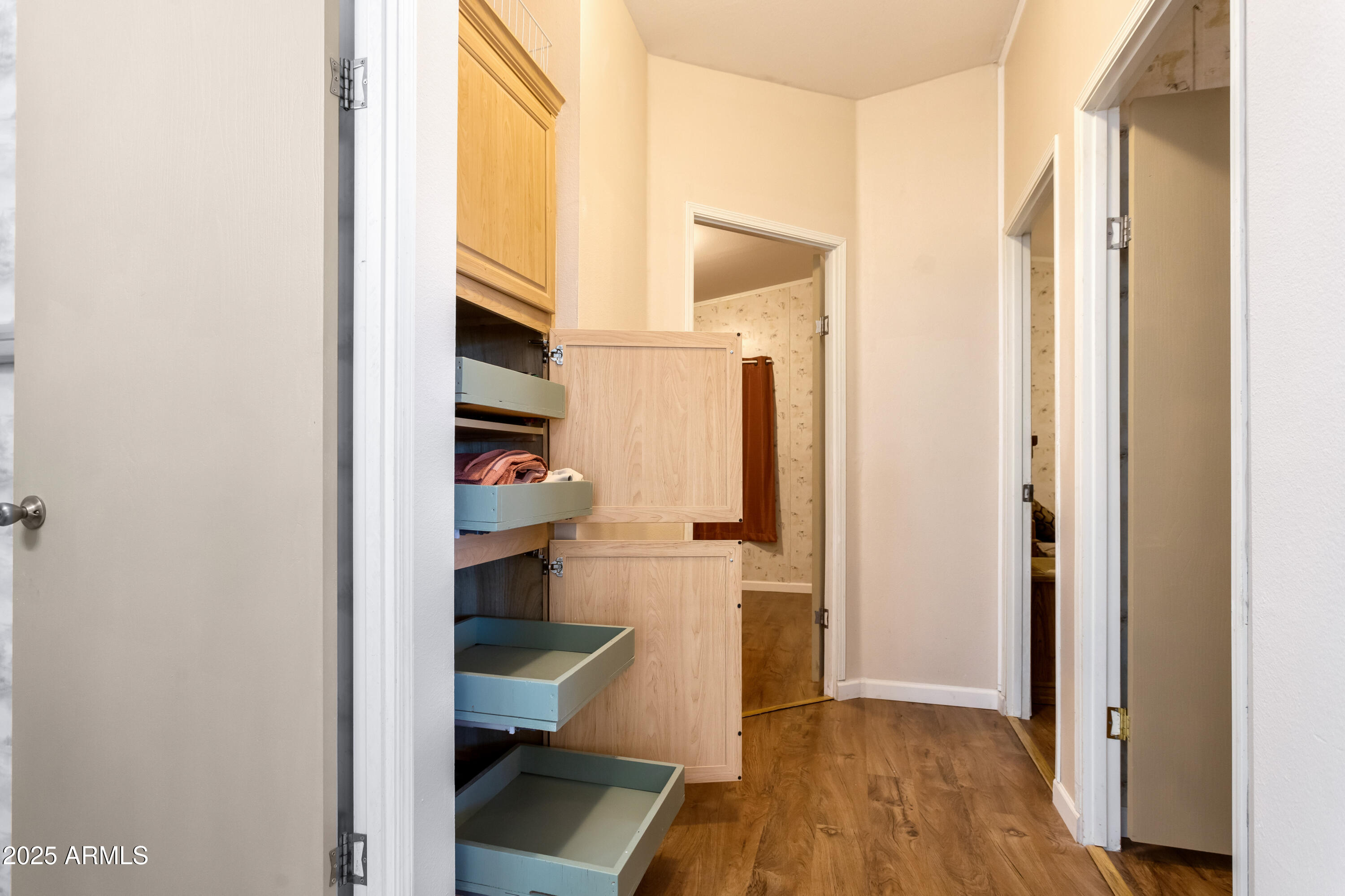 1907 East Vía Ocotillo Douglas, AZ 85607 - Photo 9 of 49 a view of walk in closet with clothes and shoes