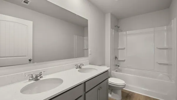 a bathroom with a sink toilet tub and shower