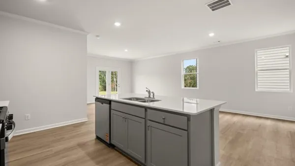 a kitchen with sink and window