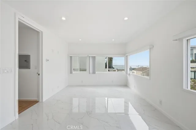 a view of empty room with windows