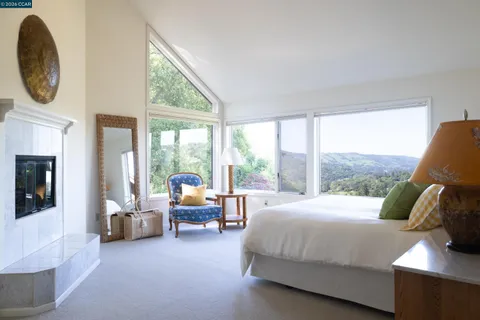 a bathroom with a tub sink and glass door