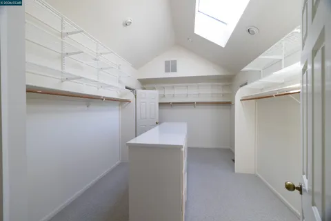 a bedroom with bed couch and window