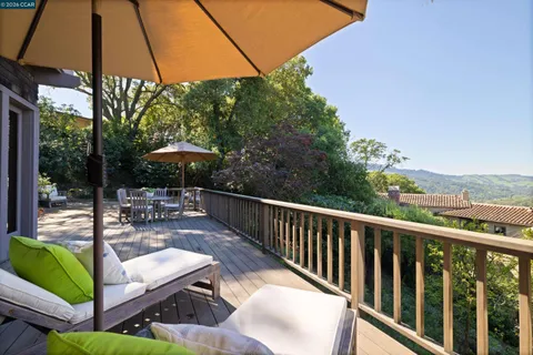 a view of a two chairs on the roof deck