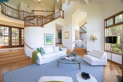 a living room with furniture or couch and a wooden floor