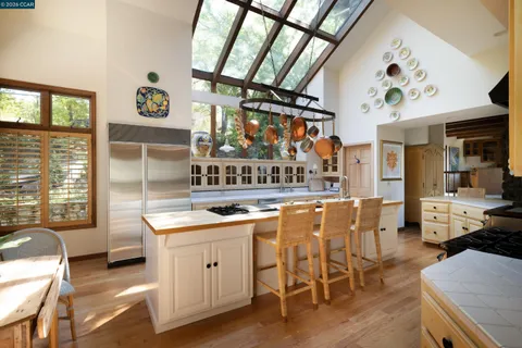 a view of a kitchen with furniture and window