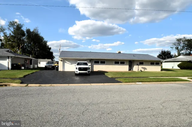 a view of street with parked cars