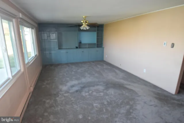 a view of a utility room with a sink and a window