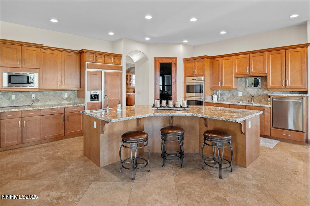 13005 Silver Wolf Road Reno, NV 89511 - Photo 21 of 40 a large kitchen with cabinets