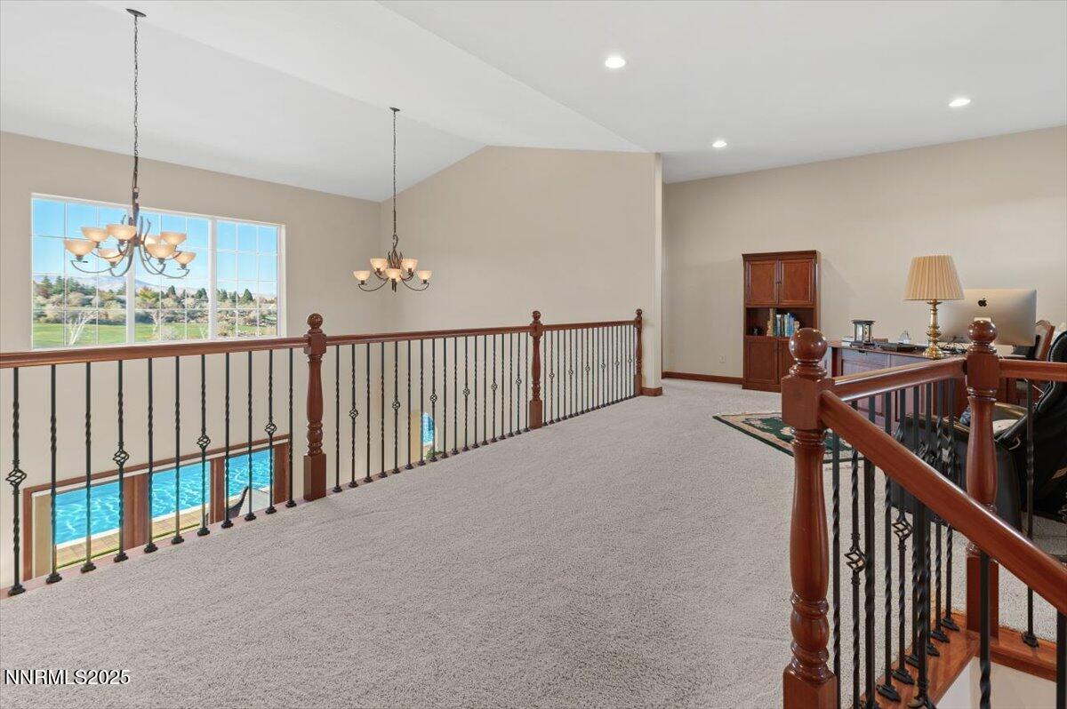 13005 Silver Wolf Road Reno, NV 89511 - Photo 25 of 40 a view of a hallway with workspace and stairs