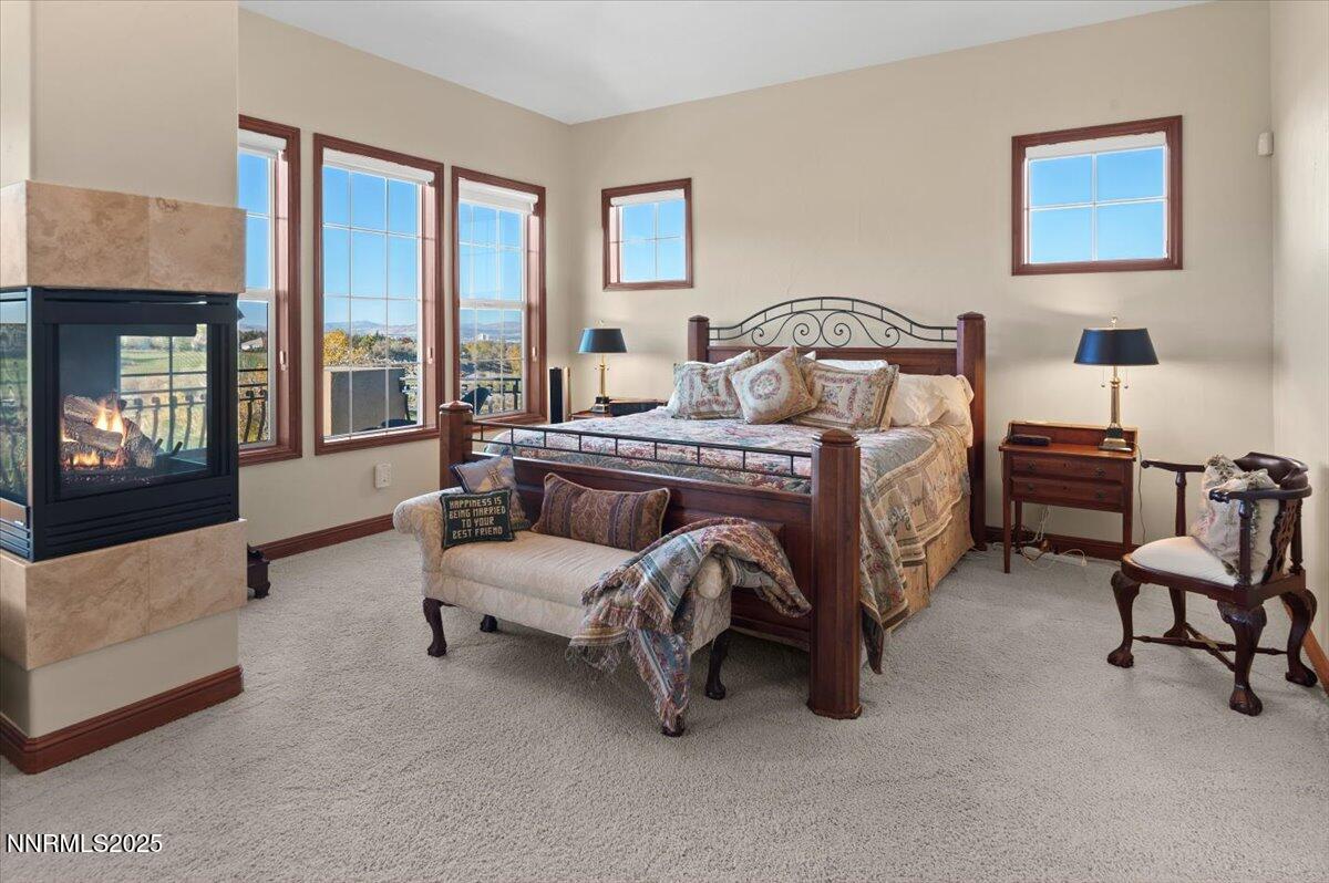 13005 Silver Wolf Road Reno, NV 89511 - Photo 27 of 40 a bedroom with a bed chair and window