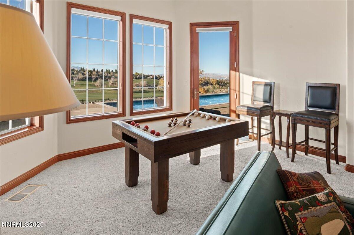13005 Silver Wolf Road Reno, NV 89511 - Photo 33 of 40 a room with furniture pool table and windows