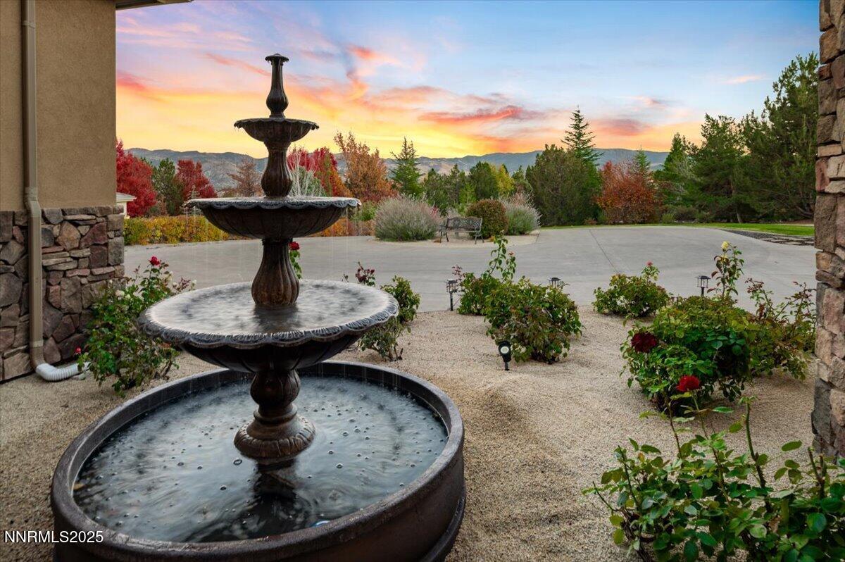 13005 Silver Wolf Road Reno, NV 89511 - Photo 5 of 40 a view of a fountain in the backyard of a house