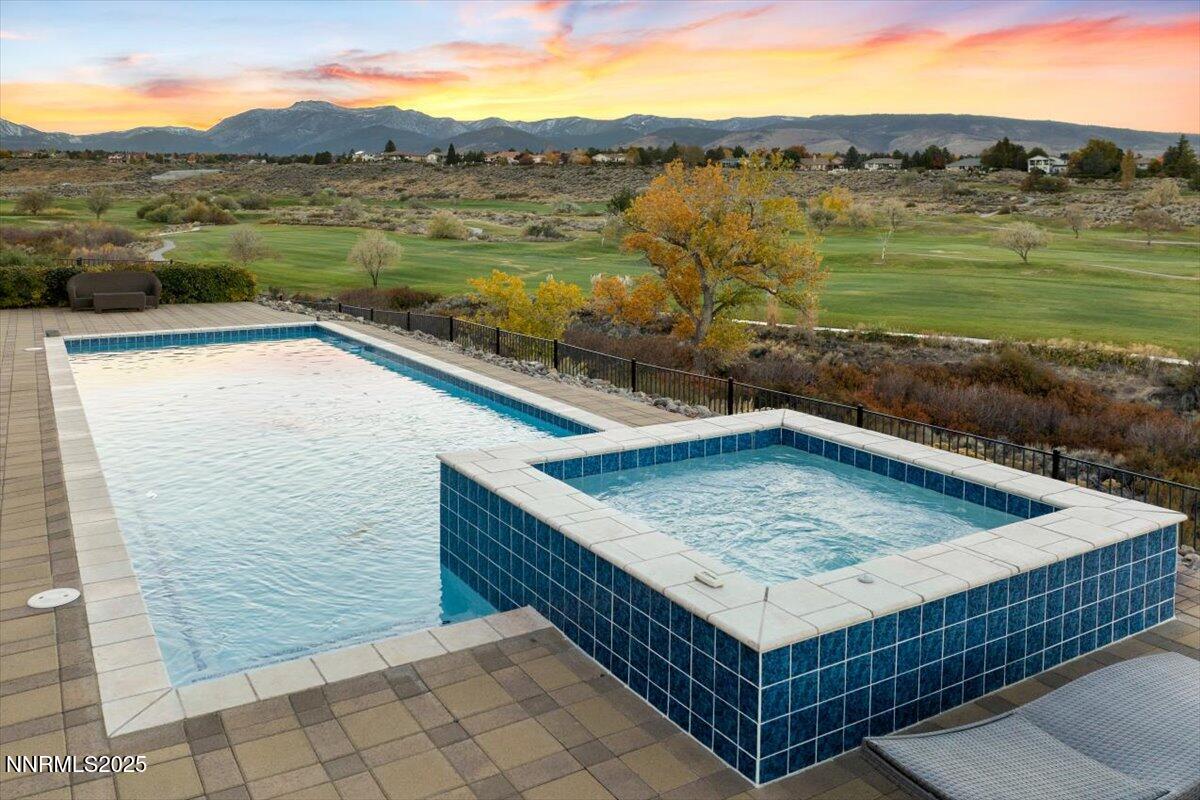 13005 Silver Wolf Road Reno, NV 89511 - Photo 9 of 40 a view of a swimming pool with a lake