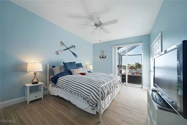 a bedroom with a bed and a view of kitchen