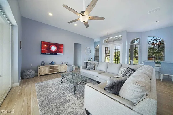 a living room with furniture and a flat screen tv