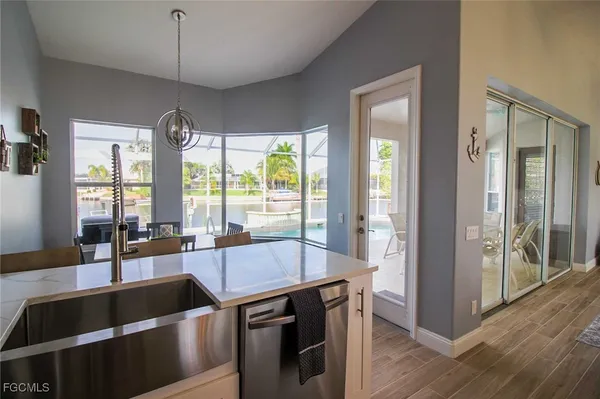 a view of a kitchen with a large window