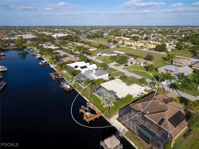 an aerial view of a house with a ocean view