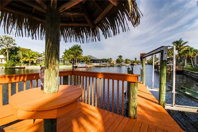 a balcony with table and chairs