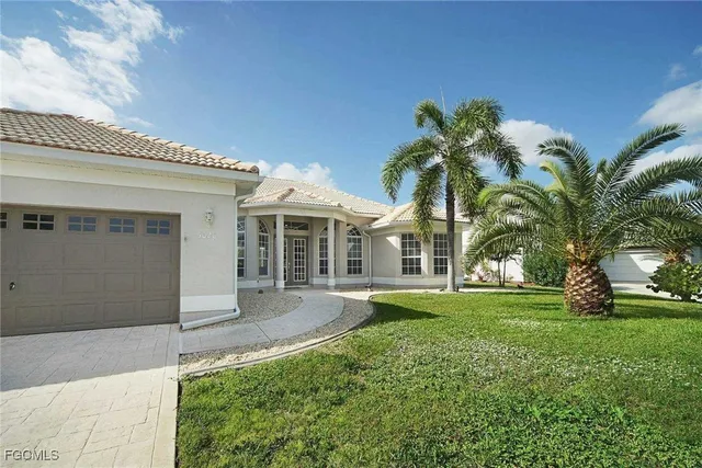 a front view of house with yard and green space