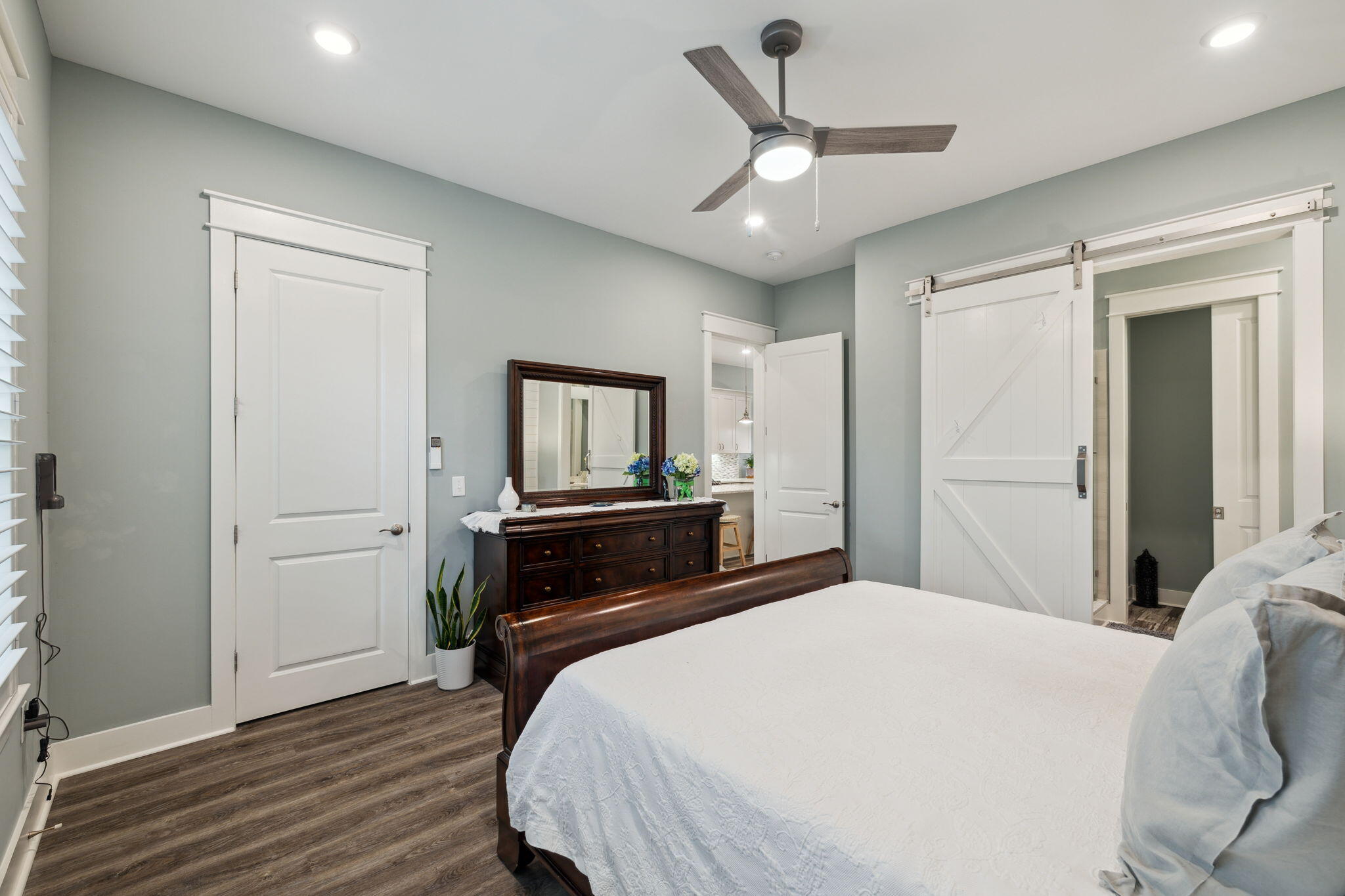 38 Constant Avenue Santa Rosa Beach, FL 32459 - Photo 16 of 36 a bedroom with a bed and a chandelier