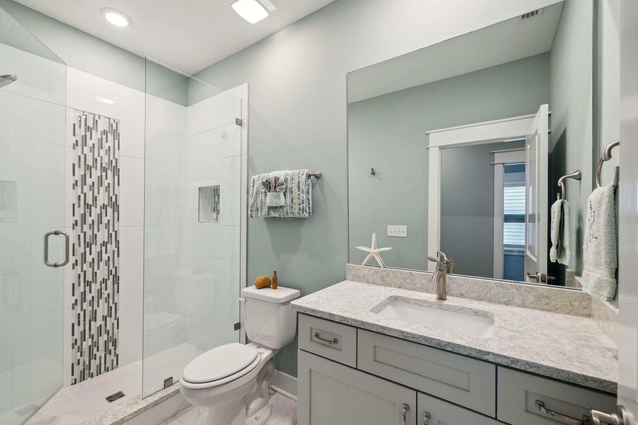 38 Constant Avenue Santa Rosa Beach, FL 32459 - Photo 25 of 36 a bathroom with a granite countertop sink a toilet and shower