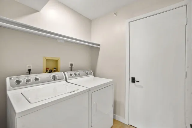 a bedroom with a bed a chair and a window