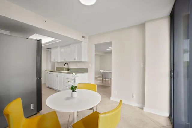 a bedroom with a large bed and a balcony view