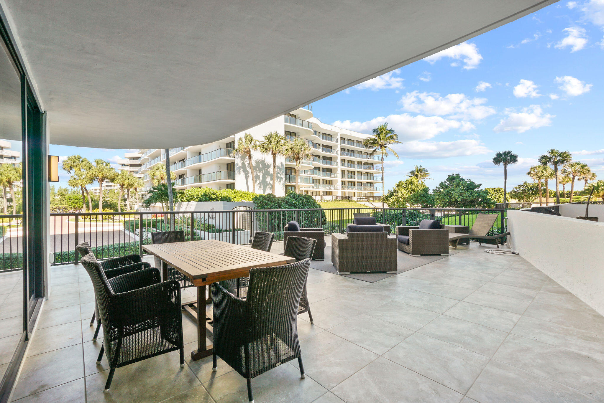 3440 South Ocean Boulevard, Unit 105S Palm Beach, FL 33480 - Photo 20 of 77 a view of a dining room with furniture and chandelier