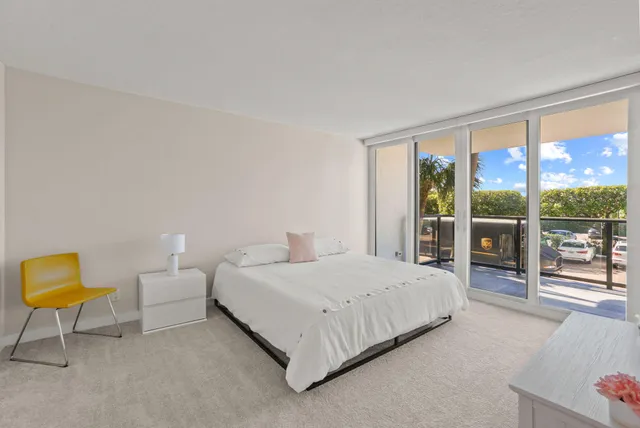 a view of balcony with a table and chairs
