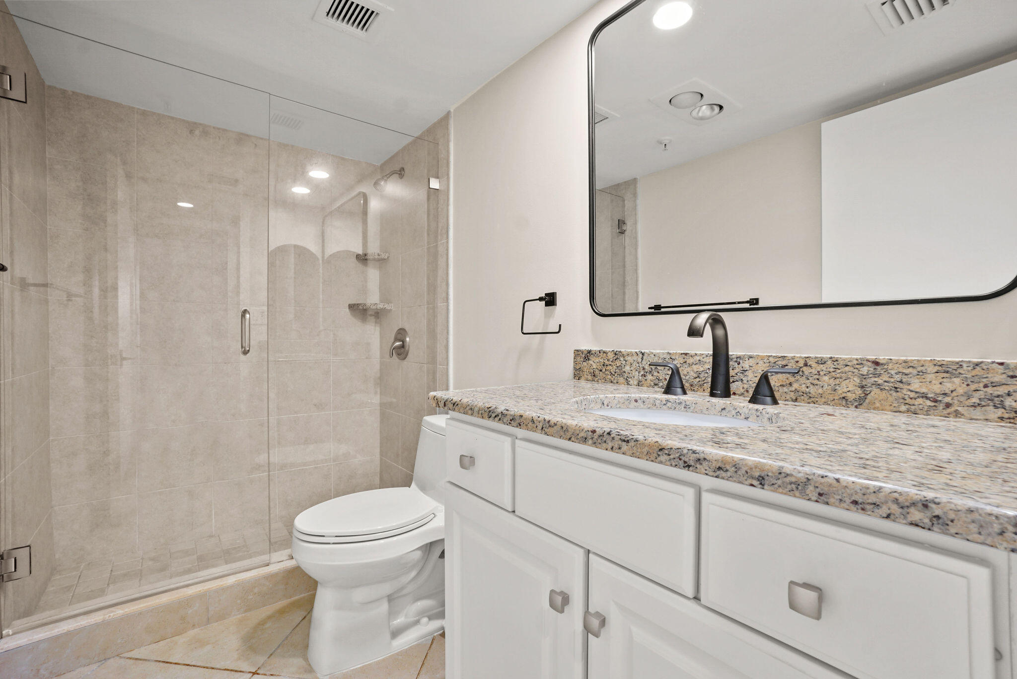 3440 South Ocean Boulevard, Unit 105S Palm Beach, FL 33480 - Photo 26 of 77 a bathroom with a granite countertop sink a toilet and a shower
