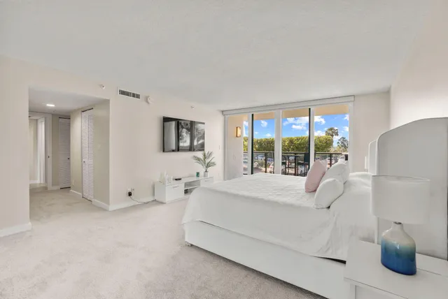 a spacious bathroom with a mirror and a shower
