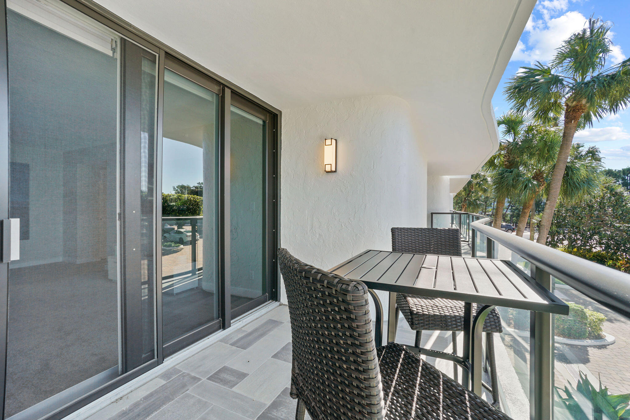 3440 South Ocean Boulevard, Unit 105S Palm Beach, FL 33480 - Photo 34 of 77 a view of balcony with a table and chairs