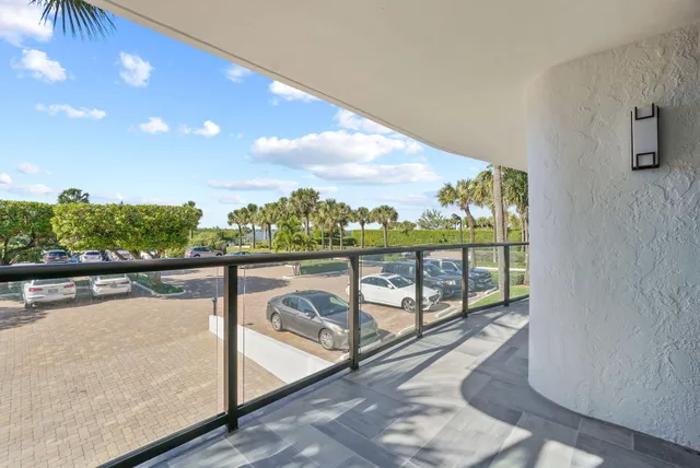 a sign that is sitting in front of flowers