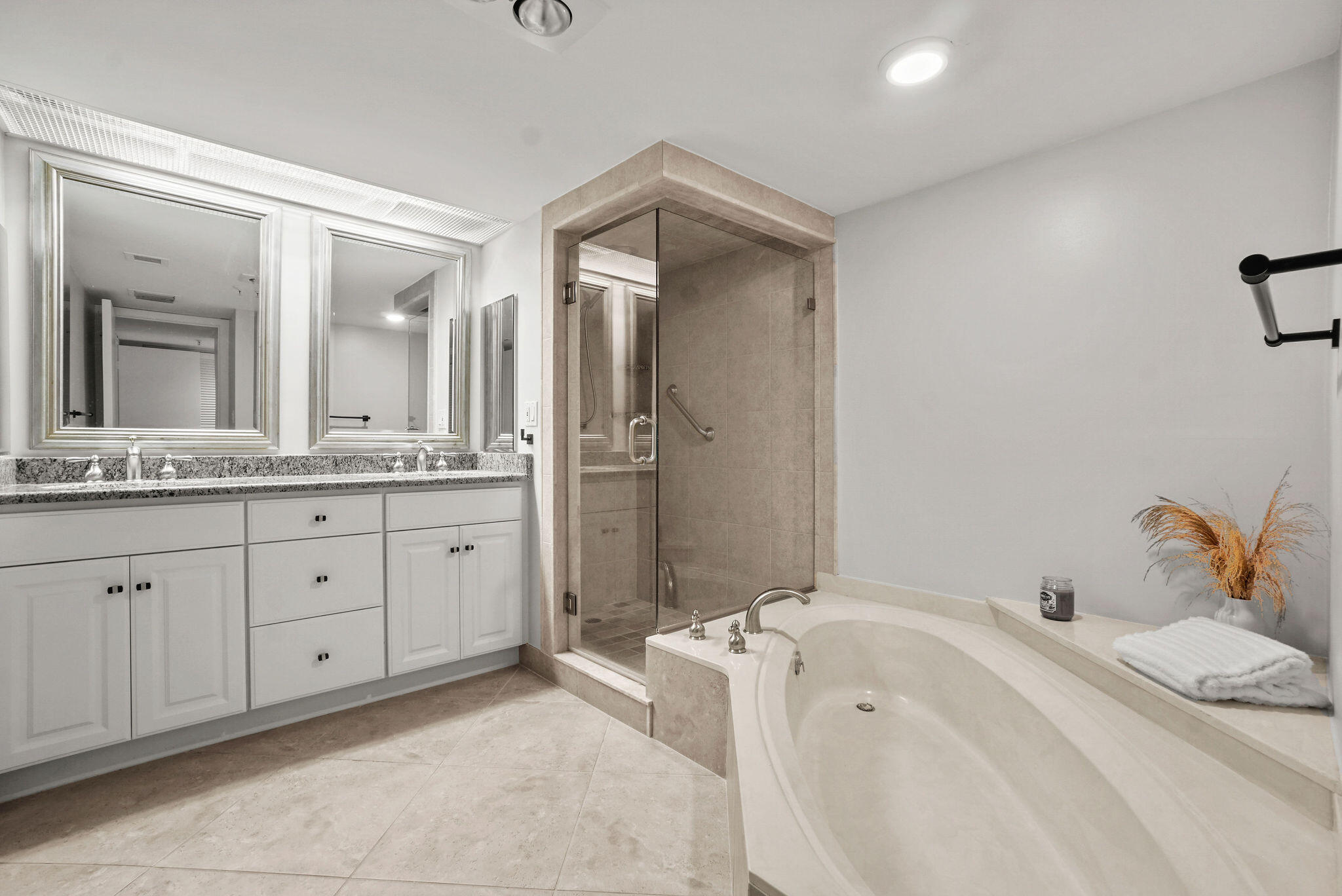 3440 South Ocean Boulevard, Unit 105S Palm Beach, FL 33480 - Photo 37 of 77 a spacious bathroom with a double vanity sink mirror and bathtub