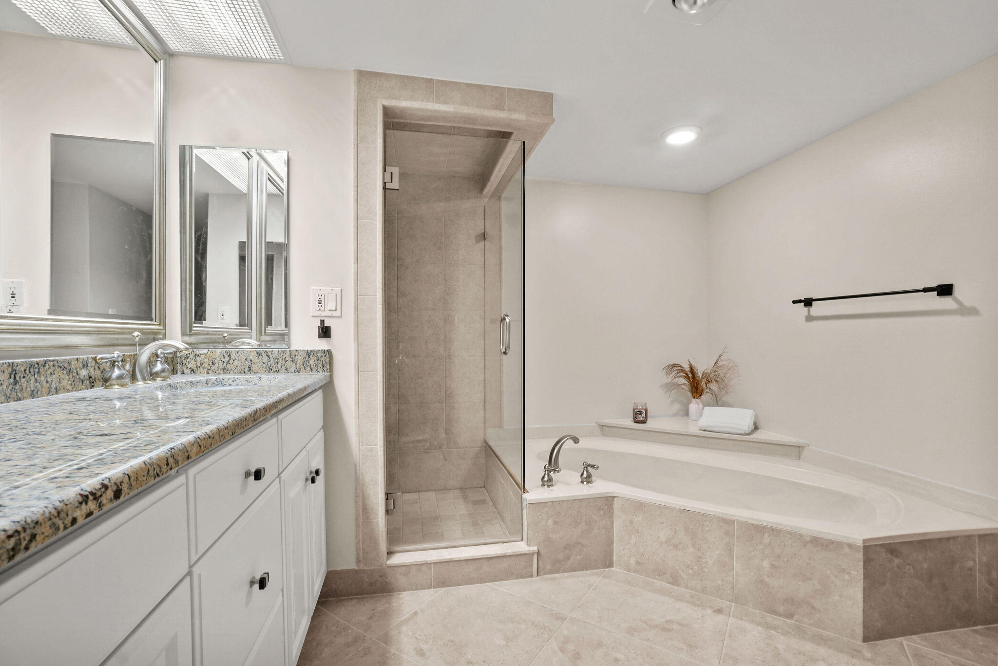3440 South Ocean Boulevard, Unit 105S Palm Beach, FL 33480 - Photo 38 of 77 a bathroom with a granite countertop sink mirror and a bathtub