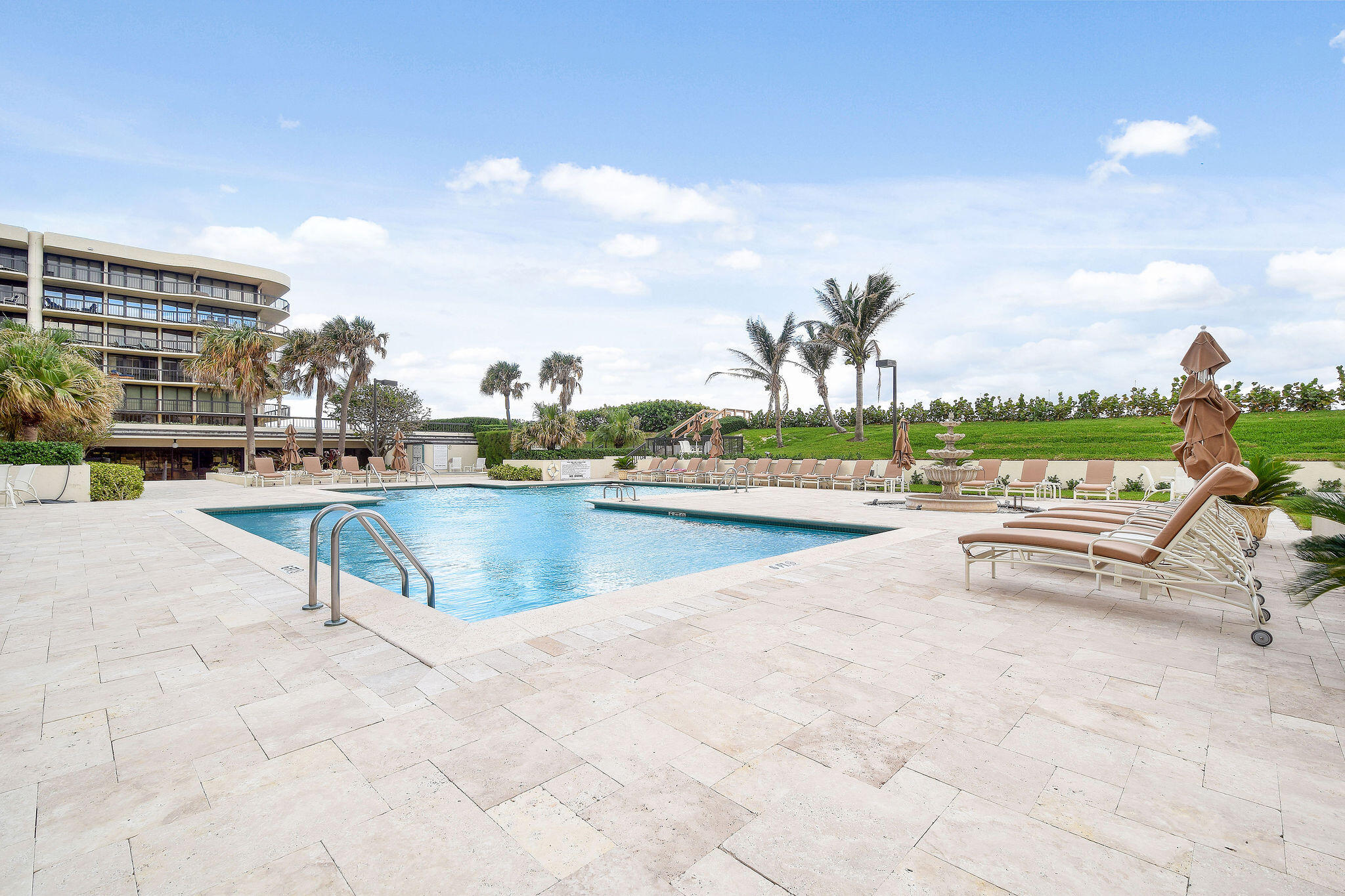3440 South Ocean Boulevard, Unit 105S Palm Beach, FL 33480 - Photo 44 of 77 a view of swimming pool outdoor seating and city view