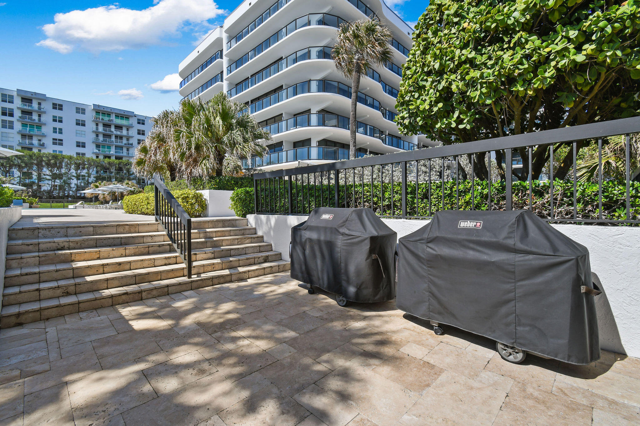 3440 South Ocean Boulevard, Unit 105S Palm Beach, FL 33480 - Photo 57 of 77 a view of a patio with couches table and chairs and potted plants