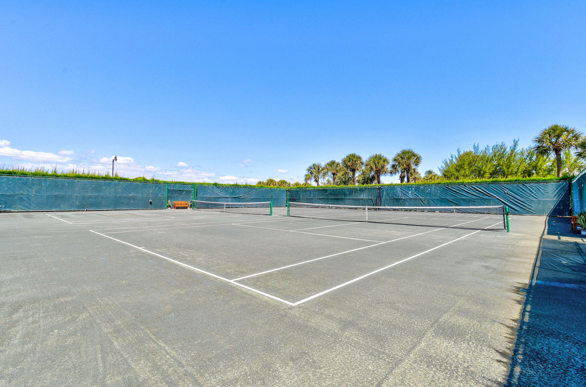 3440 South Ocean Boulevard, Unit 105S Palm Beach, FL 33480 - Photo 63 of 77 a view of a tennis court