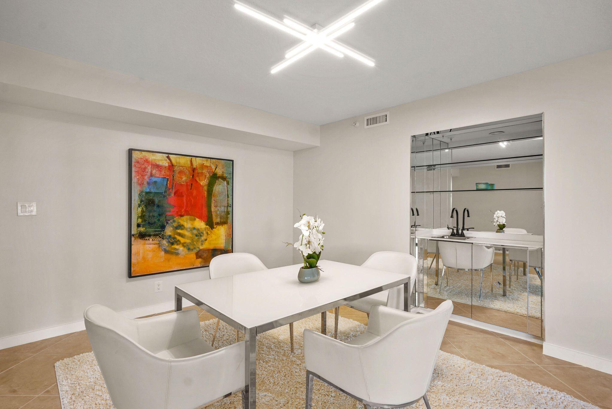 3440 South Ocean Boulevard, Unit 105S Palm Beach, FL 33480 - Photo 7 of 77 a view of a dining room with furniture and wooden floor