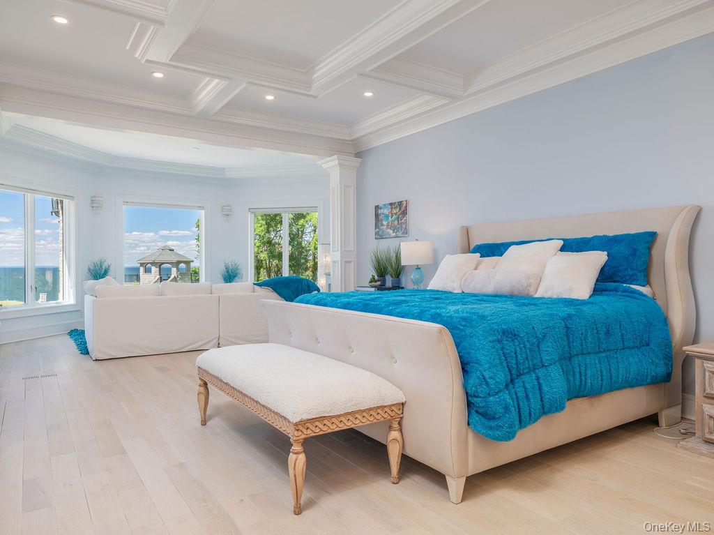 3875 Hallock Lane Mattituck, NY 11952 - Photo 15 of 50 Bedroom featuring light wood-style floors, beamed ceiling, coffered ceiling, and recessed lighting