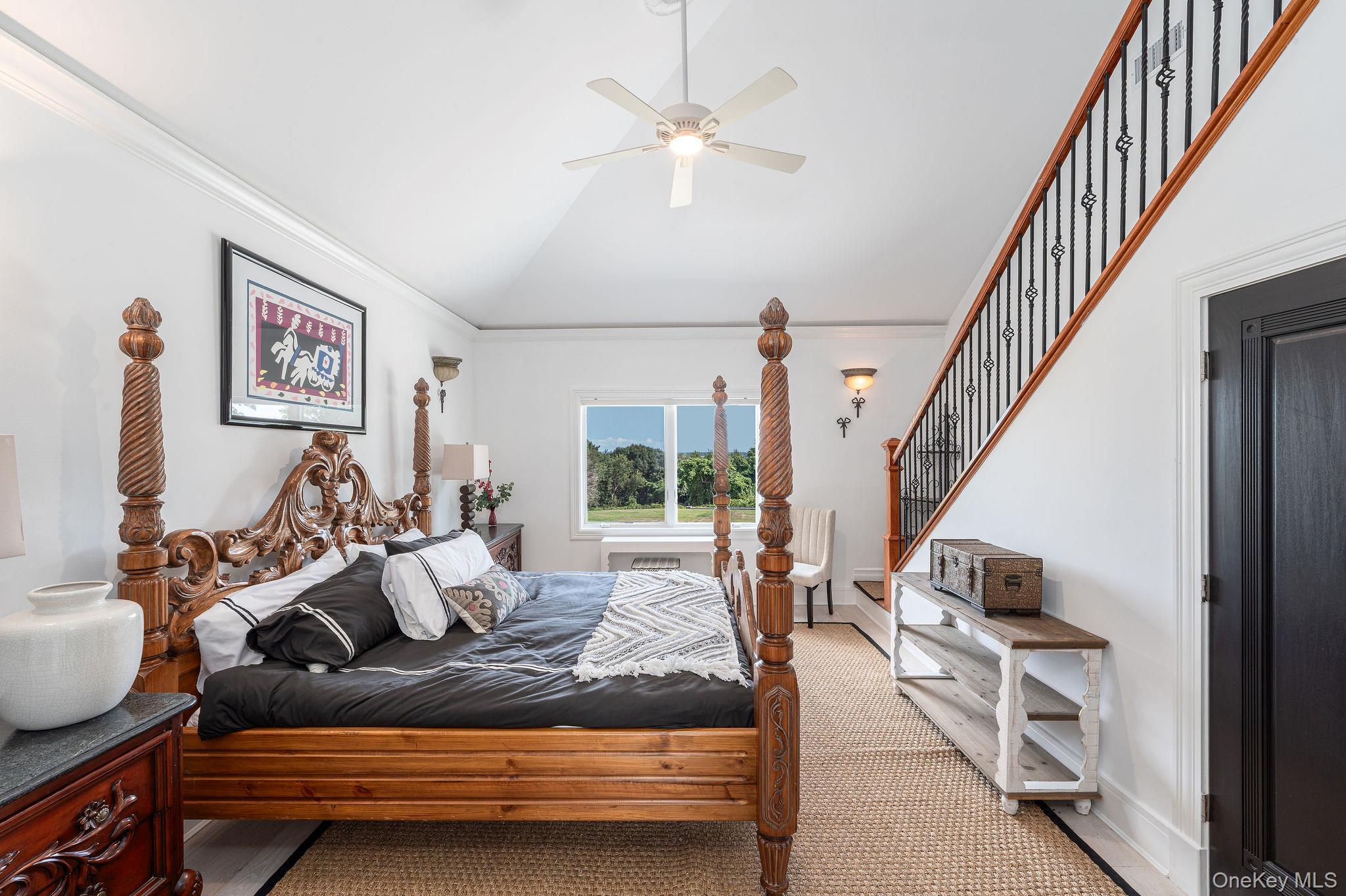 3875 Hallock Lane Mattituck, NY 11952 - Photo 30 of 50 Bedroom with carpet, vaulted ceiling, a ceiling fan, and ornamental molding